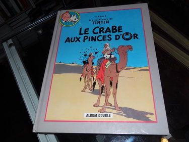 Couverture de Le crabe aux pinces d'or Suivi de Tintin au pays de l'or noir (Les aventures de Tintin)