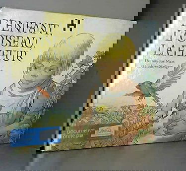 L'enfant, l'oiseau, la fleur